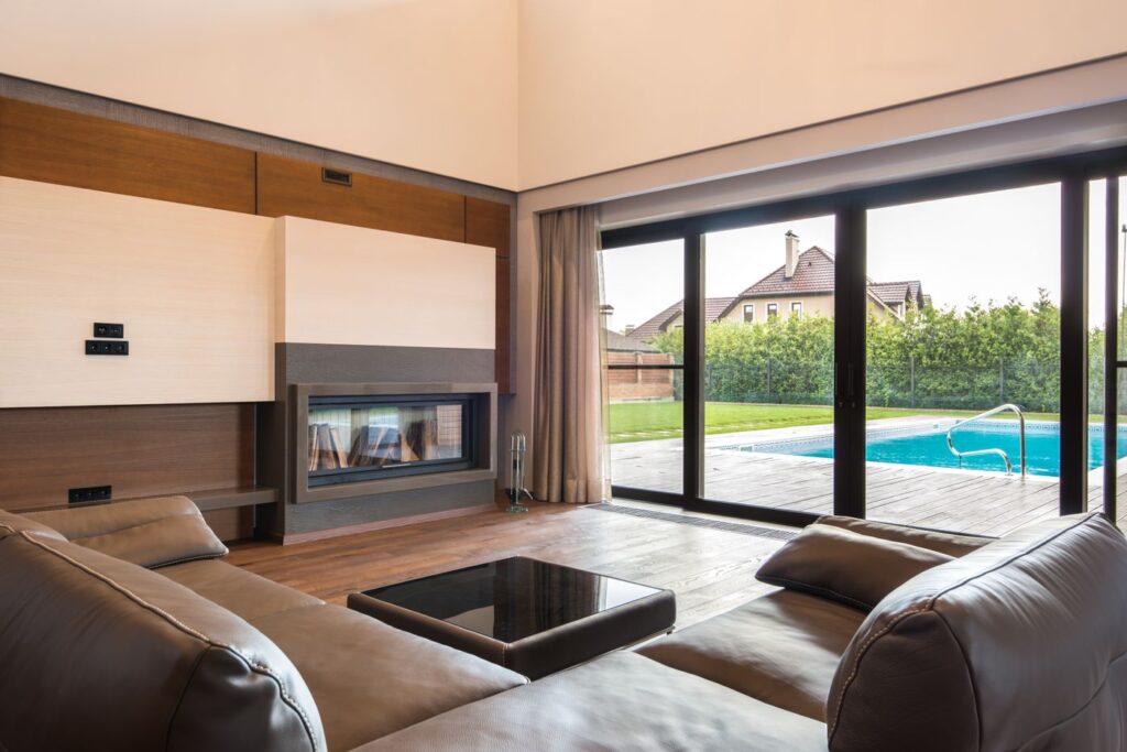 Bright living room with large glass sliders keeping the view and daylight