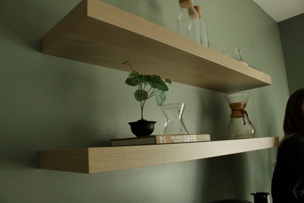 Level floating wall shelves with books and decor securely mounted