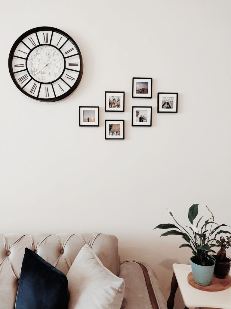 Elegant living room with straight, level framed art arranged on the wall