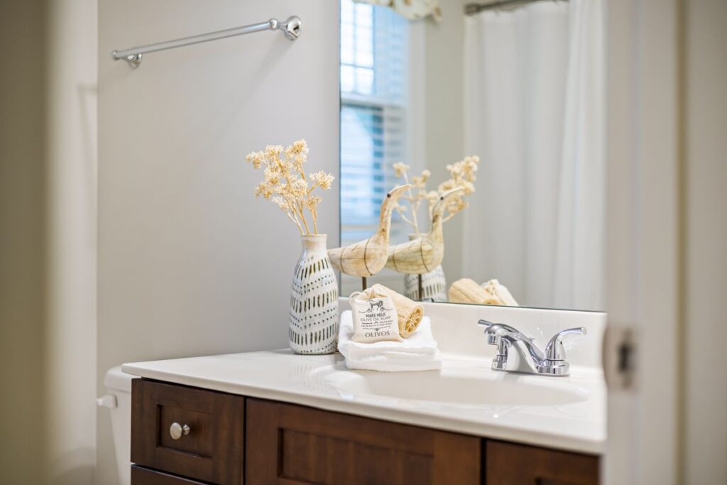 Bathroom vanity mirror mounted securely and level above the sink