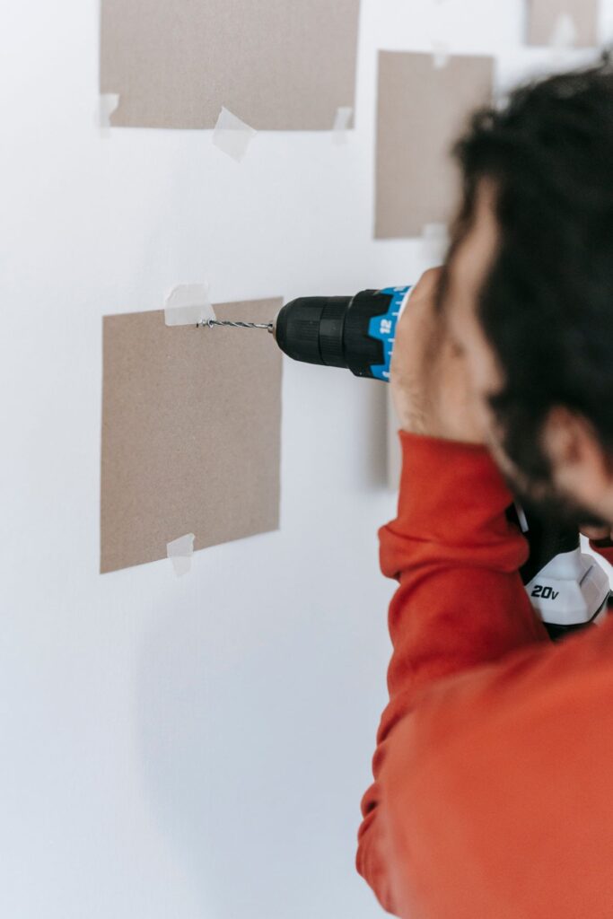 Handyman using a power drill for interior home repair