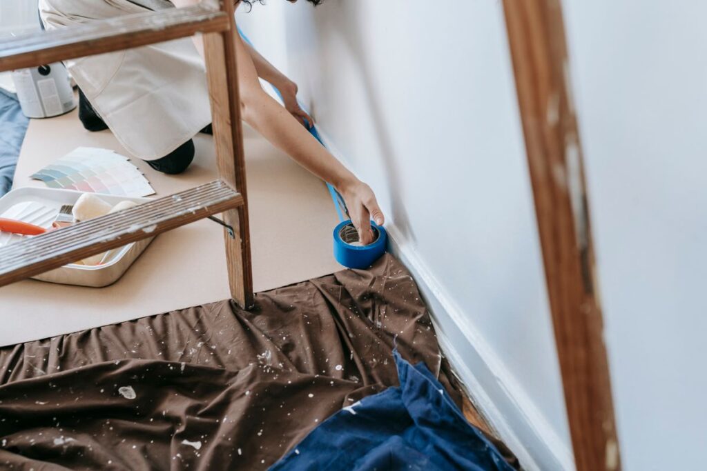 Masking and surface prep with painter's tape before painting