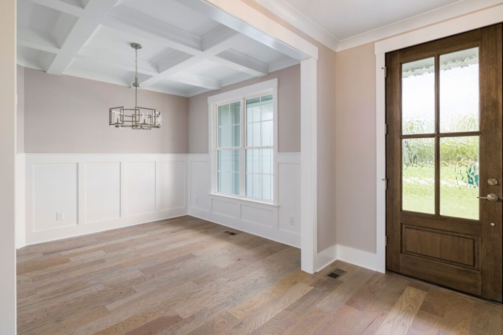 Interior room with clean door casing and finished trim molding